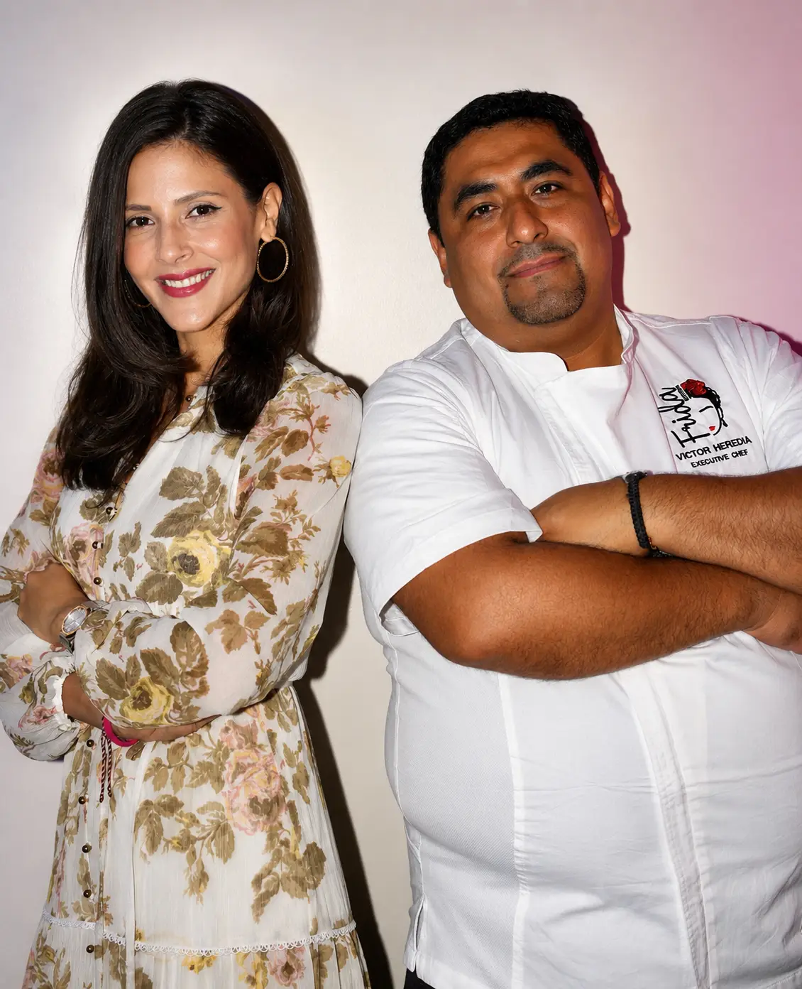 Portrait of Victor Heredia, executive chef, smiling with Camila, owner of Frida Midtown